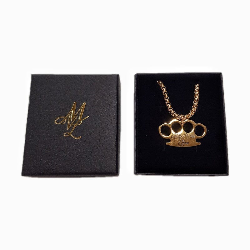 Gouden MVL Logo ketting in de geopende zwarte doos naast het deksel met gouden MVL monogram